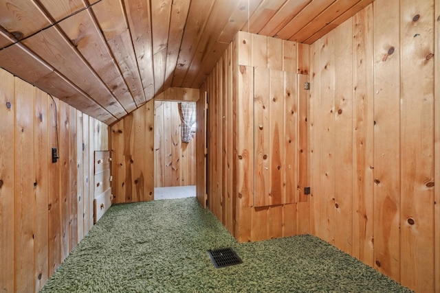 bonus room with visible vents, carpet floors, lofted ceiling, wood ceiling, and wood walls