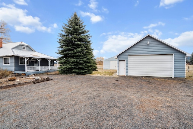 view of yard with a garage and an outdoor structure