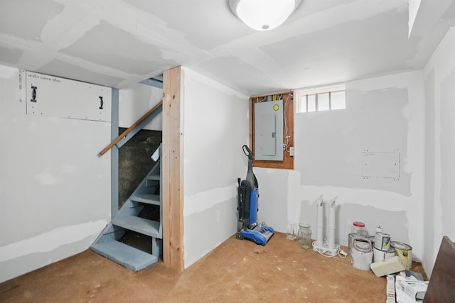 basement featuring electric panel and stairs