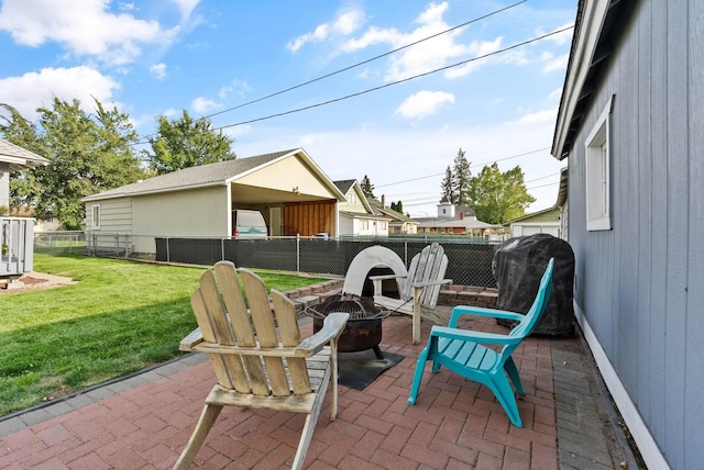 view of patio with a fire pit, a fenced backyard, and grilling area