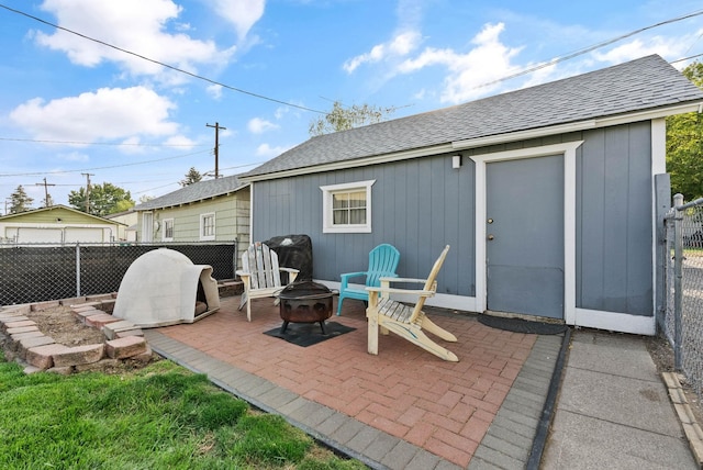 view of patio / terrace featuring an outdoor fire pit and fence