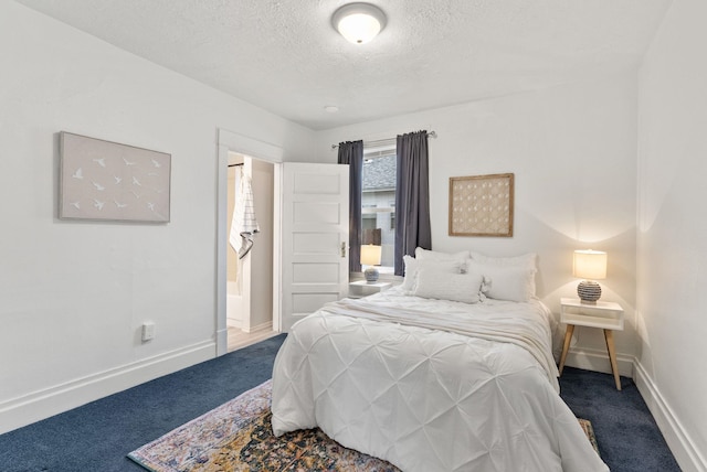 bedroom with baseboards, carpet floors, and a textured ceiling