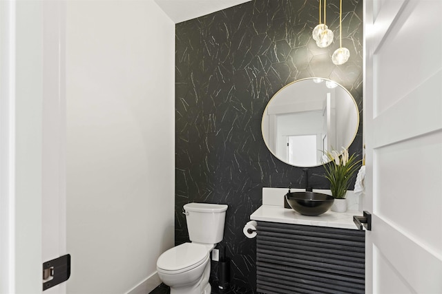 bathroom featuring toilet and vanity