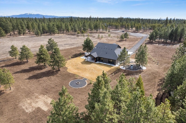 aerial view featuring a rural view and a view of trees