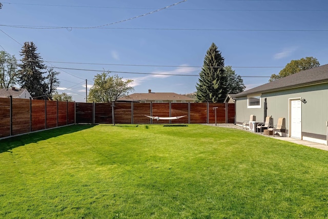 view of yard with a fenced backyard