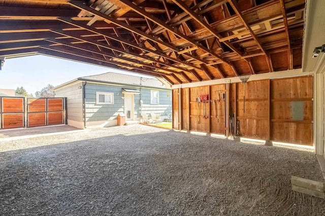 garage featuring wooden walls