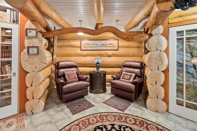 living area featuring beamed ceiling, wood ceiling, and log walls