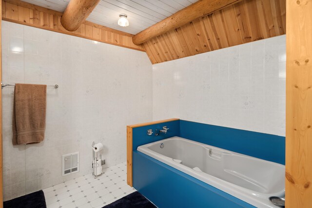 full bath with visible vents, a garden tub, tile walls, wooden ceiling, and vaulted ceiling with beams