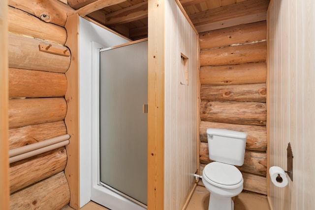 bathroom with toilet and a shower stall