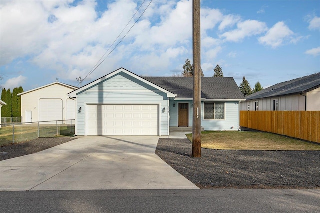 ranch-style home featuring a front yard, fence, a garage, and driveway