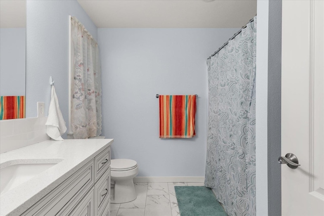 full bath featuring baseboards, toilet, marble finish floor, and vanity