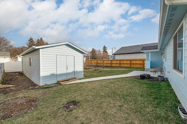 view of yard with an outbuilding and a fenced backyard