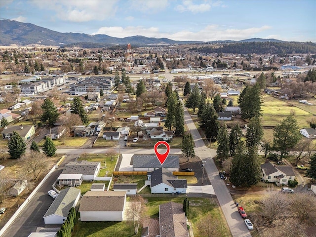 birds eye view of property featuring a mountain view and a residential view