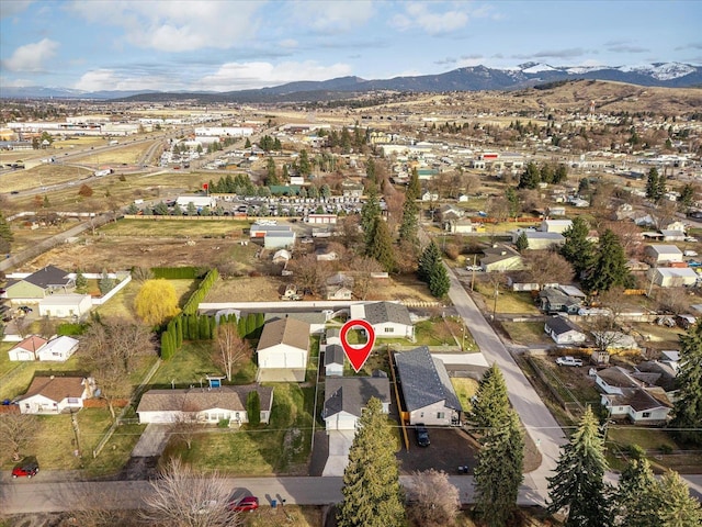 drone / aerial view featuring a residential view and a mountain view