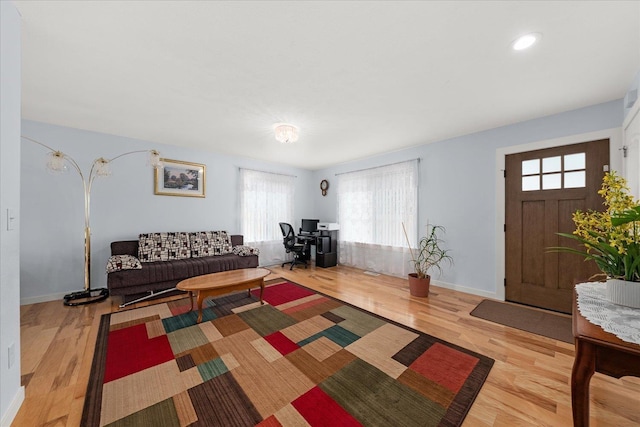 living room featuring baseboards and wood finished floors