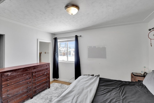 bedroom featuring a textured ceiling