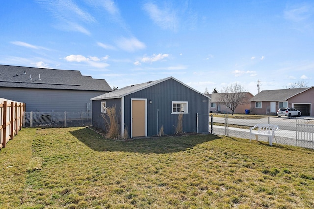 view of yard with an outbuilding and a fenced backyard