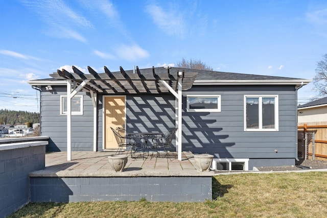 back of property featuring a patio area, fence, a yard, and a pergola