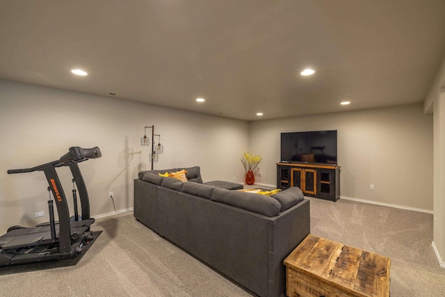 carpeted living room with recessed lighting and baseboards