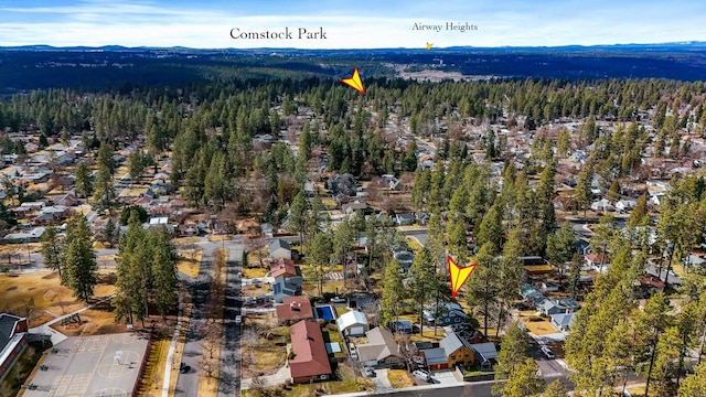 aerial view featuring a mountain view and a wooded view