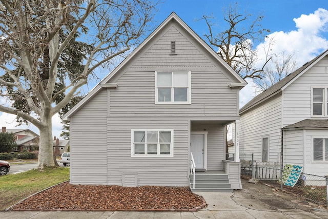 view of front of property featuring fence