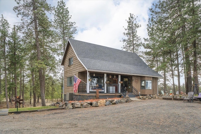 view of front of home featuring a porch and a shingled roof