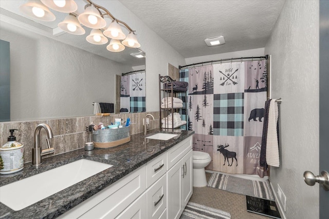 full bathroom featuring visible vents, a textured ceiling, toilet, and a sink