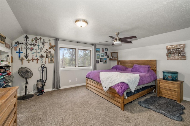 bedroom featuring baseboards, carpet floors, a textured ceiling, and vaulted ceiling