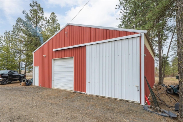 detached garage featuring driveway