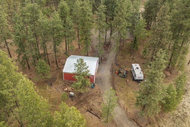 birds eye view of property with a forest view