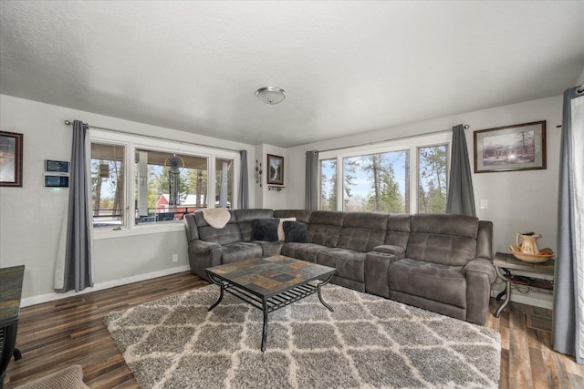 living room featuring wood finished floors and baseboards