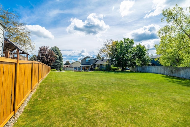 view of yard with a fenced backyard