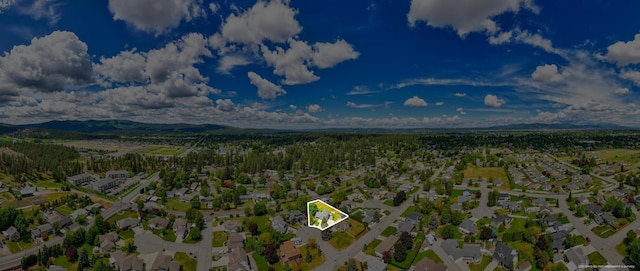 drone / aerial view with a mountain view and a residential view