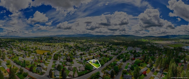 drone / aerial view featuring a mountain view and a residential view