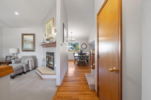 interior space featuring recessed lighting, light wood-style floors, and an inviting chandelier