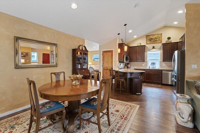 dining space with recessed lighting, baseboards, lofted ceiling, and dark wood-type flooring