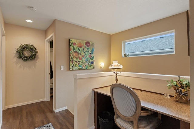 office area with baseboards and wood finished floors