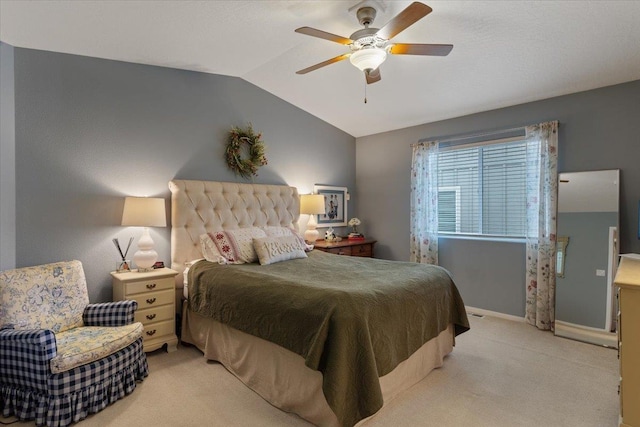 carpeted bedroom featuring baseboards, a ceiling fan, and vaulted ceiling