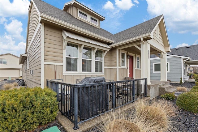 exterior space with a shingled roof