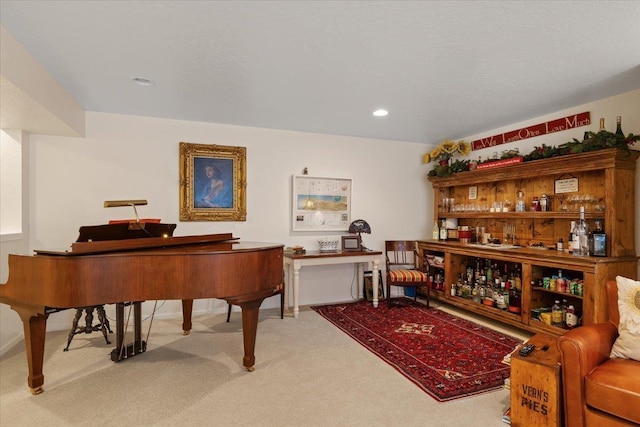 living area featuring recessed lighting and carpet flooring