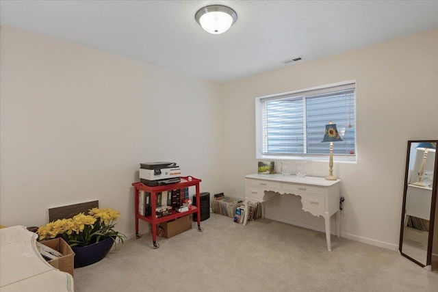 office area with light colored carpet and visible vents