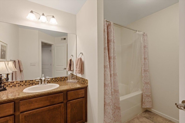 bathroom featuring tile patterned floors, decorative backsplash, vanity, and shower / bath combo with shower curtain