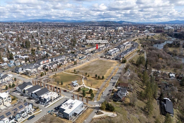 drone / aerial view featuring a mountain view and a residential view