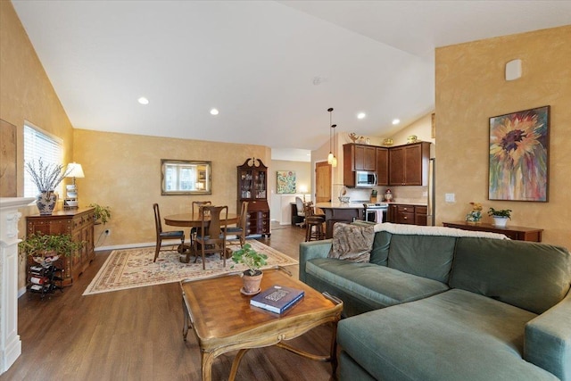 living area featuring recessed lighting, high vaulted ceiling, baseboards, and wood finished floors