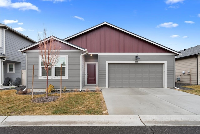 ranch-style house with concrete driveway, a garage, and a front lawn