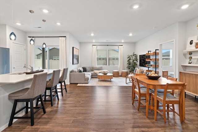 dining area with recessed lighting and dark wood finished floors