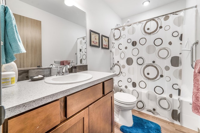 full bathroom with vanity, shower / bath combination with curtain, toilet, and wood finished floors