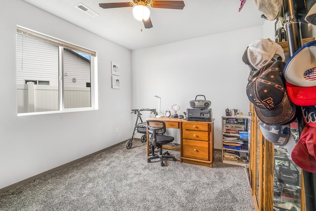 carpeted home office with baseboards, visible vents, and ceiling fan