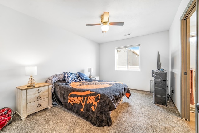 bedroom featuring light carpet, visible vents, and ceiling fan