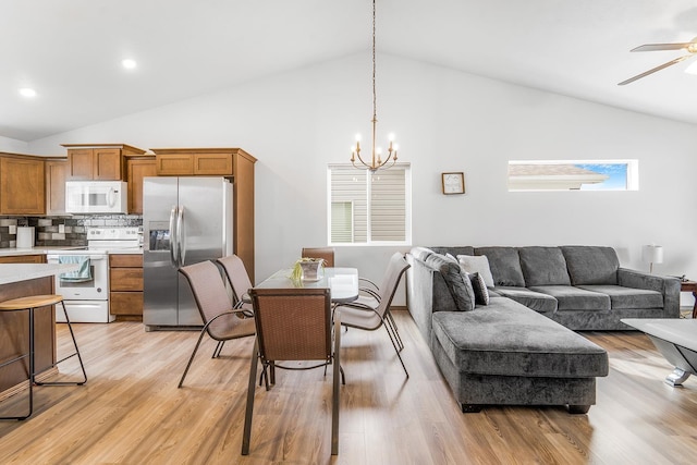 interior space featuring recessed lighting, ceiling fan with notable chandelier, and light wood-type flooring